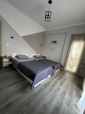 a bedroom with two beds in a room at Casa Di Leandro in Athens