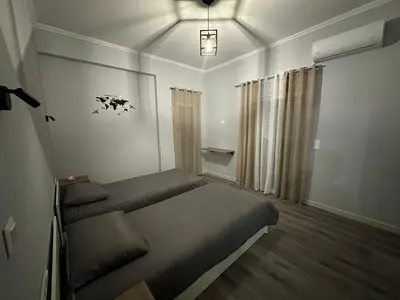 a small bedroom with a bed and a window at Casa Di Leandro in Athens