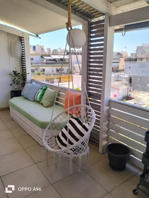 a porch with a hammock on a balcony at Minimal flat in Kalithea in Athens