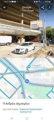 a picture of a car parked in front of a building at Central Cosy quite 28sm 5th floor balcony over garden 500m Metro Evangelismos in Athens