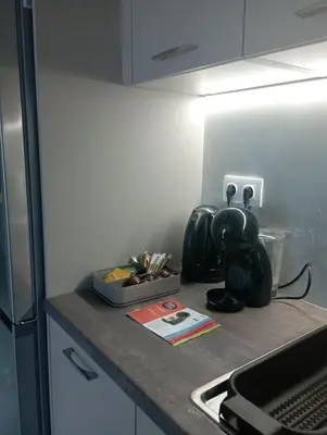 a kitchen counter with a tea kettle on it at Modern 2 bedroom Apartment near Kallimarmaro and Alsos in Athens
