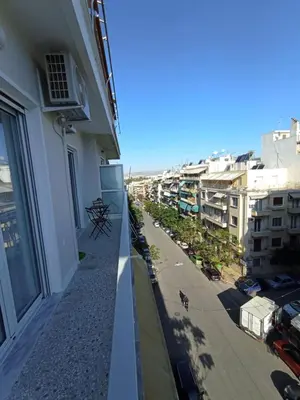 a balcony of a building with a view of a street at Modern 2 bedroom Apartment near Kallimarmaro and Alsos in Athens