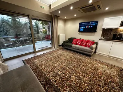 a living room with a couch and a tv at Air Suite in Spáta