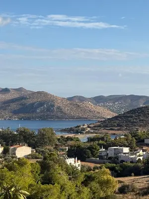 a view of a town with a lake and mountains at Sea View Serenity in Athens in Anavissos