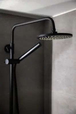 a shower with a shower head in a bathroom at Pangrati Gem views to Lycabettus in Athens