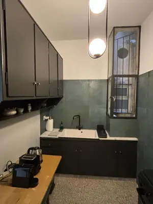 a kitchen with a tub and a sink and a window at Pangrati Gem views to Lycabettus in Athens