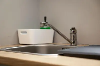 a kitchen sink with a faucet and a toaster at ERMES 2-BD Retreat with Acropolis view in Athens