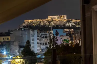 a view ofhens at night with the acropolis at Jacuzzi Patio & Acropolis view 2-BD Retreat in Athens