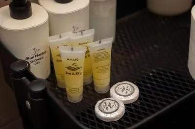 a rack with a bunch of moisturizing products on it at Jacuzzi Patio & Acropolis view 2-BD Retreat in Athens