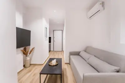 a living room with a couch and a table at Alma Suite - close to Acropolis in Athens