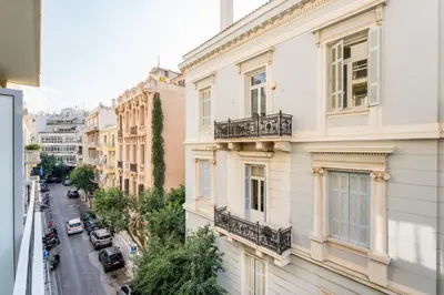 a view of a city street from a building at Alma Suite - close to Acropolis in Athens