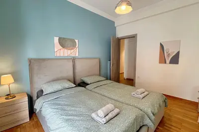 two beds in a bedroom with towels on them at National Park in Athens