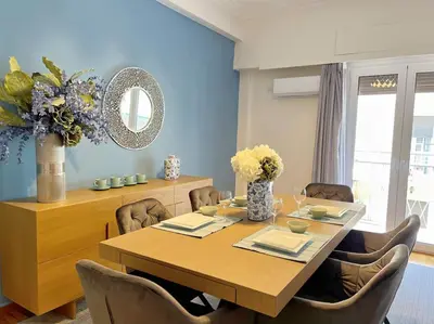a dining room with a wooden table and chairs at National Park in Athens