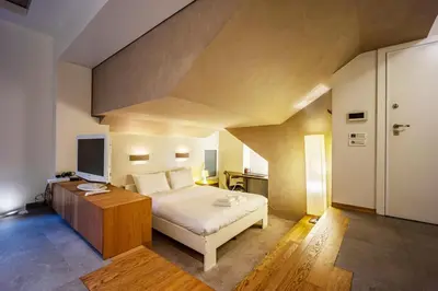 a bedroom with a bed and a television in it at Alia by GK Properties in Athens