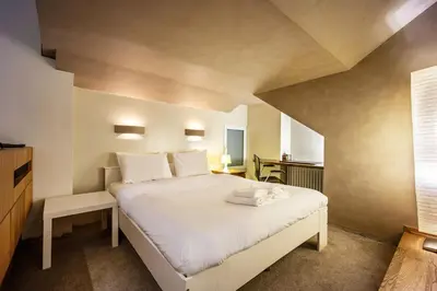 a bedroom with a large white bed in a room at Alia by GK Properties in Athens