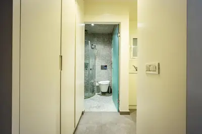 a bathroom with a toilet and a walk in shower at Alia by GK Properties in Athens