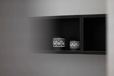 two black and white pots sitting on a shelf at Urban Chic Hideaway Near Athens Center & Metro in Athens