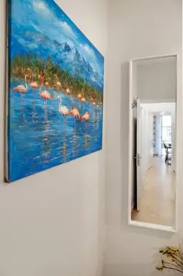 a painting of flamingos in the water on a wall at Athens Lycabettus hill, 2 bd apt- Apokafkon in Athens