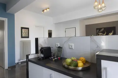 a bowl of fruit on a counter in a kitchen at Modern Renovated Apartment in Metaksourgio in Athens