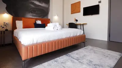 a bedroom with a bed with towels on it at The Solon House-Self check-in in Athens