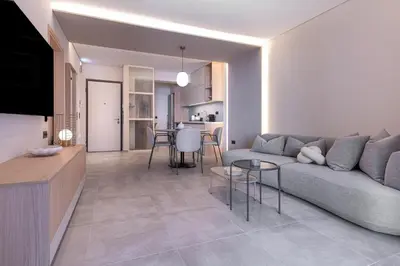 a living room with a couch and a table at Phaedrus Living Athens Luxury Residences Champagne in Athens