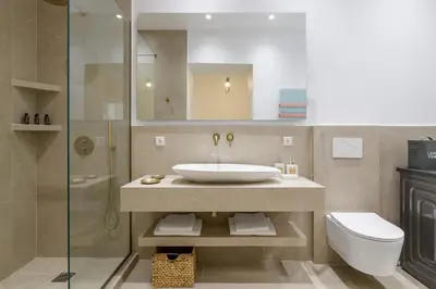 a bathroom with a sink and a toilet and a shower at Koukaki Cielo Villa10 -Pvt Yard 3BR 8ppl -10min Metro Acropolis in Athens