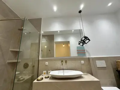 a bathroom with a sink and a shower at Koukaki Cielo Villa10 -Pvt Yard 3BR 8ppl -10min Metro Acropolis in Athens
