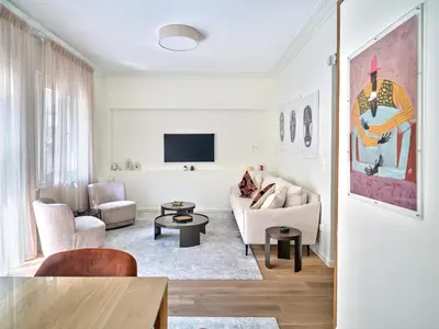 a living room with a couch and a tv at 20nty Kolonaki in Athens
