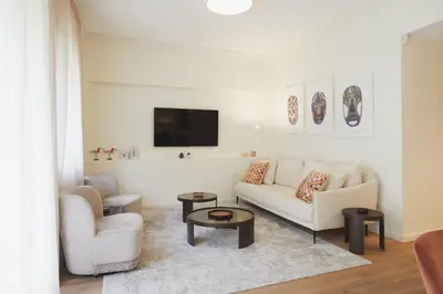 a living room with a couch and a tv at 20nty Kolonaki in Athens