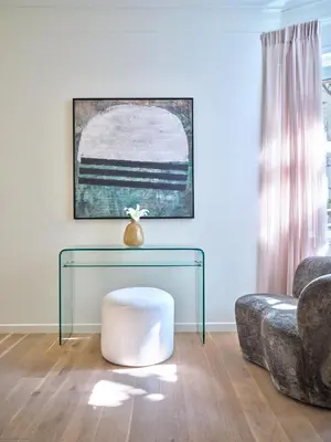 a living room with a glass table and a couch at 20nty Kolonaki in Athens