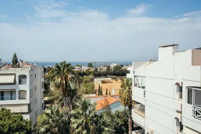 a view of a city from a building at Grand Sea View Apartment 3' from Kavouri Beach in Athens