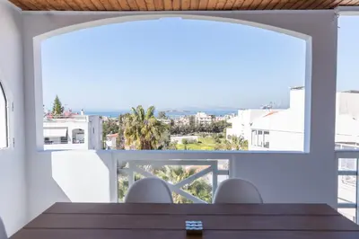a dining room with a view of the ocean at Grand Sea View Apartment 3' from Kavouri Beach in Athens