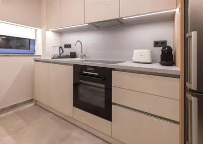 a kitchen with a sink and a stove at Phaedrus Living Athens Luxury Residences Beige in Athens