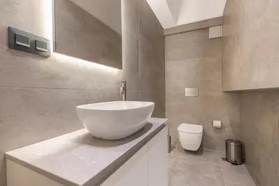 a bathroom with a bowl sink and a toilet at Phaedrus Living Athens Luxury Residences Beige in Athens