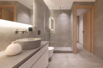 a bathroom with a white sink and a toilet at Phaedrus Living Athens Luxury Residences Beige in Athens