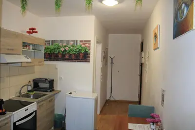a small kitchen with a sink and a counter at Cozy Mezonette near City Center Athens near Metro in Athens