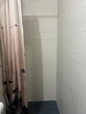 a bathroom with a shower with a shower curtain at Cozy Mezonette near City Center Athens near Metro in Athens