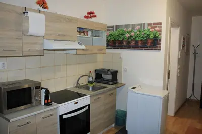 a small kitchen with a sink and a microwave at Cozy Mezonette near City Center Athens near Metro in Athens