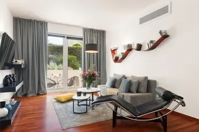 a living room with a couch and a chair at Serena Calm Pool House in Athens