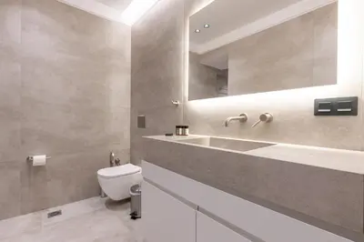 a bathroom with a sink and a toilet and a mirror at Phaedrus Living Athens Luxury Residences Golden in Athens