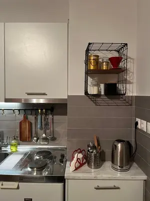 a kitchen with a stove and a counter top at Tsakalof 10 Veranda by Zeussuites in Athens