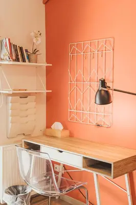 an orange office with a desk and a lamp at Tsakalof 10 Veranda by Zeussuites in Athens