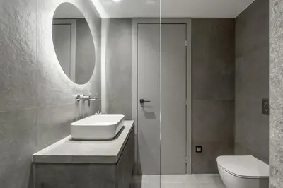 a bathroom with a sink and a toilet and a mirror at EN Suites Stylish & Comfort Stay near Acropolis in Athens