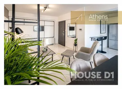 a living room with a house dj and a table at Athens House Concept Apartments in Athens