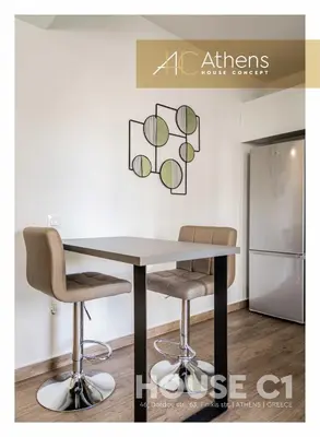 a table and two chairs in a kitchen at Athens House Concept Apartments in Athens