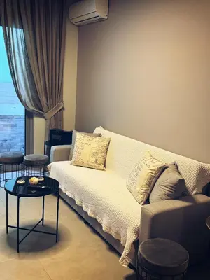 a living room with a couch and a table at Minimal 2bd apartment in Thisio in Athens