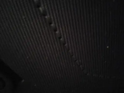 a close up of the side of a metal ceiling at Petralona in Athens