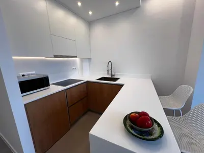 a kitchen with a bowl of fruit on a counter at Stunning View Zeas Marina - 1 bedroom in Piraeus