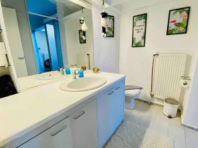 a bathroom with a sink and a toilet at Acropolis Penthouse with 50mbps WIFI in Athens