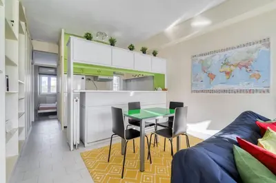 a kitchen and a dining room with a table and chairs at Acropolis Penthouse with 50mbps WIFI in Athens